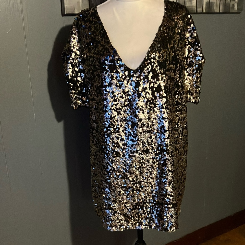 Free People gold sequined over size top with black underneath no size